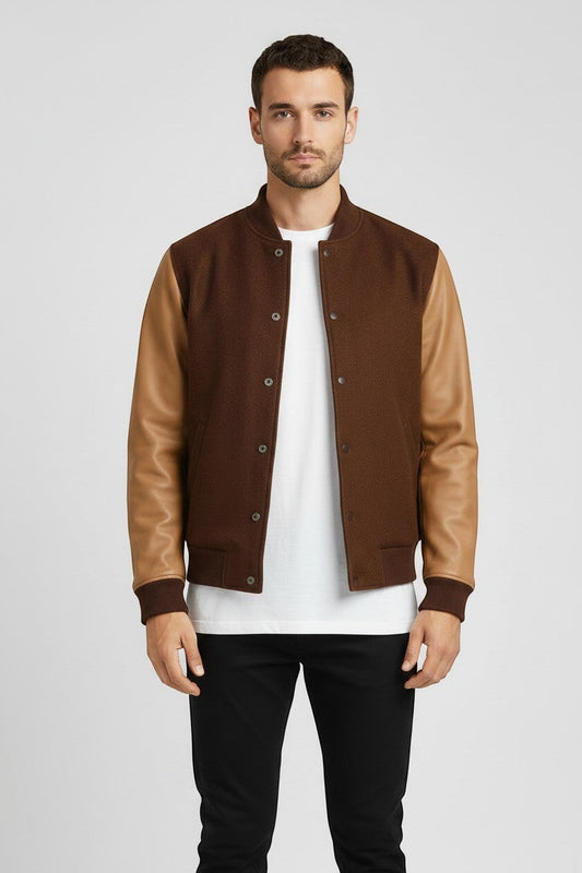Scarlett Stitch Men's brown wool-blend varsity bomber jacket with tan leather sleeves, ribbed collar, cuffs, and hem.