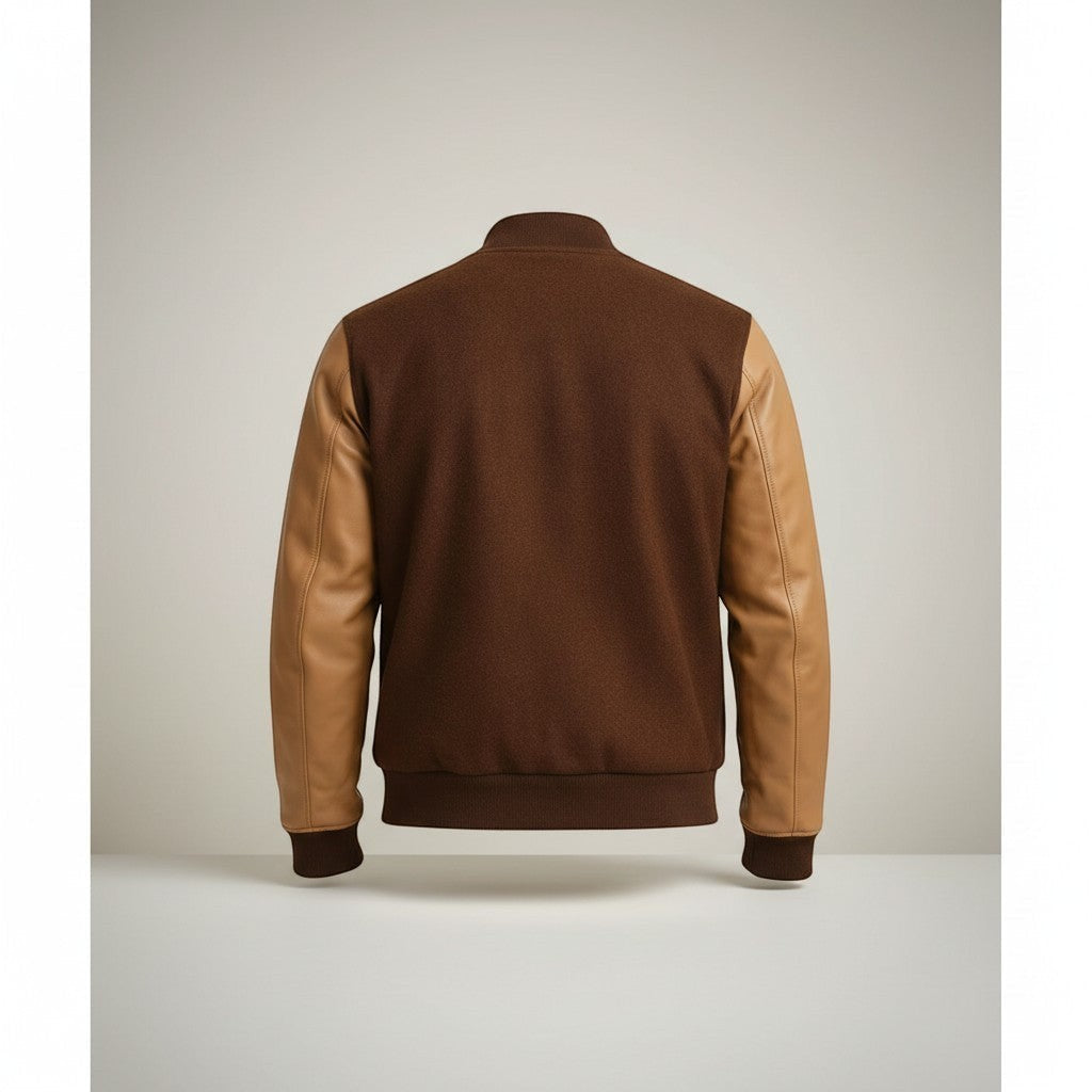 Scarlett Stitch Men's brown wool-blend varsity bomber jacket with tan leather sleeves and ribbed trim.