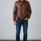 Scarlett Stitch men's brown leather bomber jacket with ribbed collar, cuffs, and hem. Features epaulets and dual chest pockets.