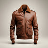 Scarlett Stitch Men's genuine leather bomber jacket in rich brown with ribbed collar, cuffs, and hem. Features zipper front and flap pockets.