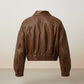 Scarlett Stitch distressed brown leather cropped bomber jacket with collar and elasticated hem.
