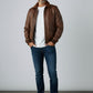 Scarlett Stitch Men's classic brown leather bomber jacket with ribbed collar, cuffs, and hem. Features epaulets and zip front.