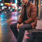 Scarlett Stitch men's brown quilted faux leather bomber jacket with ribbed collar, cuffs, and hem.