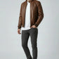 Scarlett Stitch men's brown quilted genuine leather bomber jacket with stand collar and ribbed cuffs.