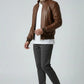 Scarlett Stitch Men's brown quilted genuine leather bomber jacket with stand collar and ribbed cuffs.