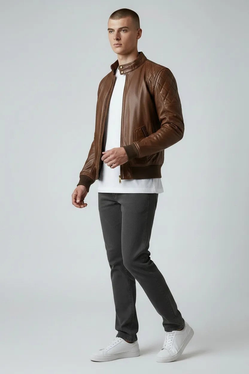 Scarlett Stitch Men's brown quilted genuine leather bomber jacket with stand collar and ribbed cuffs.