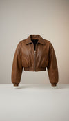 Scarlett Stitch distressed brown leather cropped bomber jacket with collar, zip-front, and elasticated cuffs and hem.