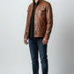 Scarlett Stitch brown leather field jacket with chest pockets and stand-up collar worn by a man with dark denim jeans