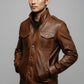 Scarlett Stitch men's brown leather field jacket with chest pockets, stand-up collar, and snap-button closure.