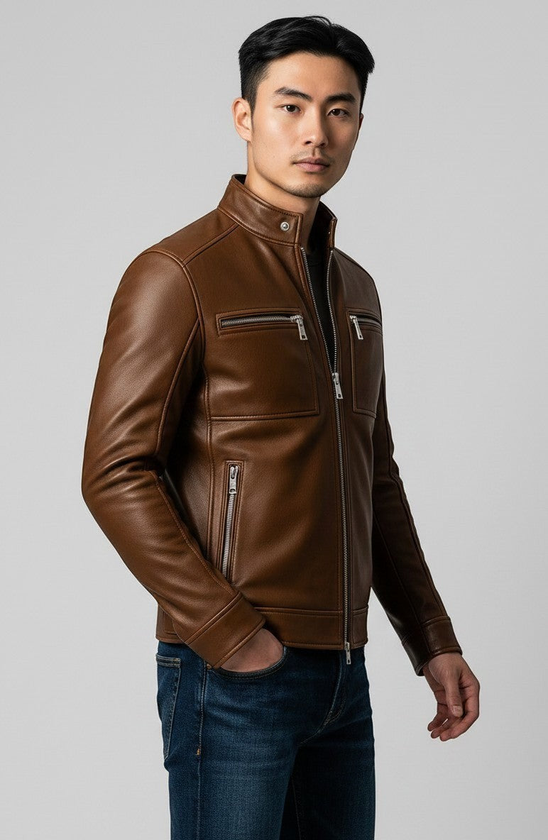 Man wearing a Scarlett Stitch brown leather jacket with a stand-up collar, metal zippers, and tailored fit.