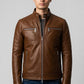 Scarlett Stitch men's brown leather jacket with stand-up collar, metal zippers, and chest pockets on a male model.