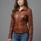 Scarlett Stitch Women's classic brown leather motorcycle jacket with zippered cuffs and buckle tabs.