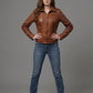 Scarlett Stitch Women's brown leather motorcycle jacket with zippered cuffs and buckle tabs. Tailored fit.