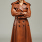 Scarlett Stitch brown leather trench coat with belt, double-breasted, epaulets, and flared skirt.
