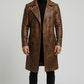 Scarlett Stitch men's brown distressed leather double-breasted trench coat worn by a model with a black turtleneck.