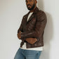 Scarlett Stitch men's brown quilted leather motorcycle jacket with asymmetrical zip and ribbed sleeve detailing.