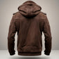 Scarlett Stitch Men's brown suede hooded bomber jacket with ribbed cuffs and hem, epaulet details, and zippered pockets.