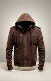 Scarlett Stitch Men's brown suede hooded bomber jacket with zip pockets and epaulet details.