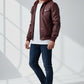 Scarlett Stitch burgundy faux leather hooded bomber jacket with ribbed cuffs and two chest pockets.