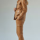 Scarlett Stitch caramel faux leather utility jacket with four front pockets and gold-tone buttons.