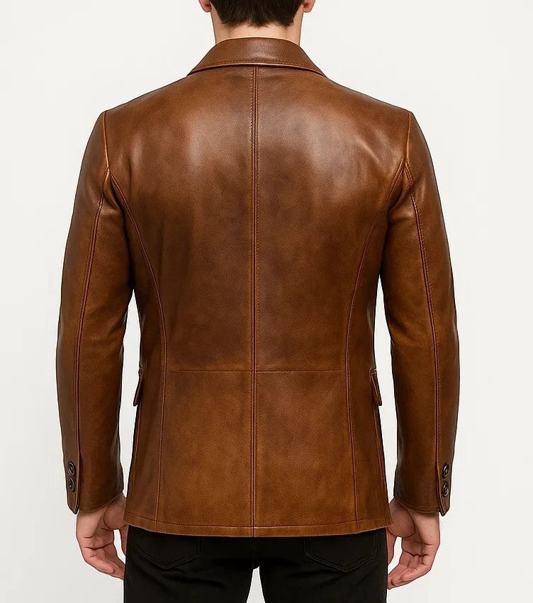 Back view of a Scarlett Stitch cognac brown leather blazer with structured tailoring and buttoned cuffs.