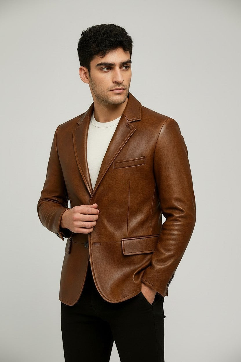 Man wearing a Scarlett Stitch cognac brown leather blazer with notch lapels and a single-button closure.