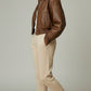 Scarlett Stitch distressed brown leather cropped bomber jacket with collar and zip front.