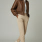 Scarlett Stitch cropped bomber jacket in distressed brown leather with collar, zip front, and elasticated cuffs and hem.