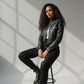 Scarlett Stitch black faux leather cropped moto jacket with diamond quilting and zippered cuffs.