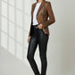 Scarlett Stitch distressed brown leather blazer with notched lapels worn by a model with black trousers.