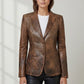 Scarlett Stitch tailored brown distressed leather blazer with notched lapels and two-button closure on a model.