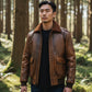 Scarlett Stitch Men's distressed brown faux leather bomber jacket with shearling collar, ribbed cuffs and flap pockets.