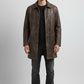 Scarlett Stitch men's distressed brown leather car coat with a structured collar and button-front closure.