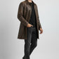 Scarlett Stitch men's distressed brown leather car coat with button closure and side pockets worn by a male model.