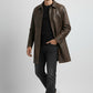 Scarlett Stitch men's distressed brown leather car coat with button front and structured collar on a male model.