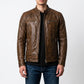 Scarlett Stitch men's distressed brown leather cafe racer jacket with quilted shoulders and zippered pockets.