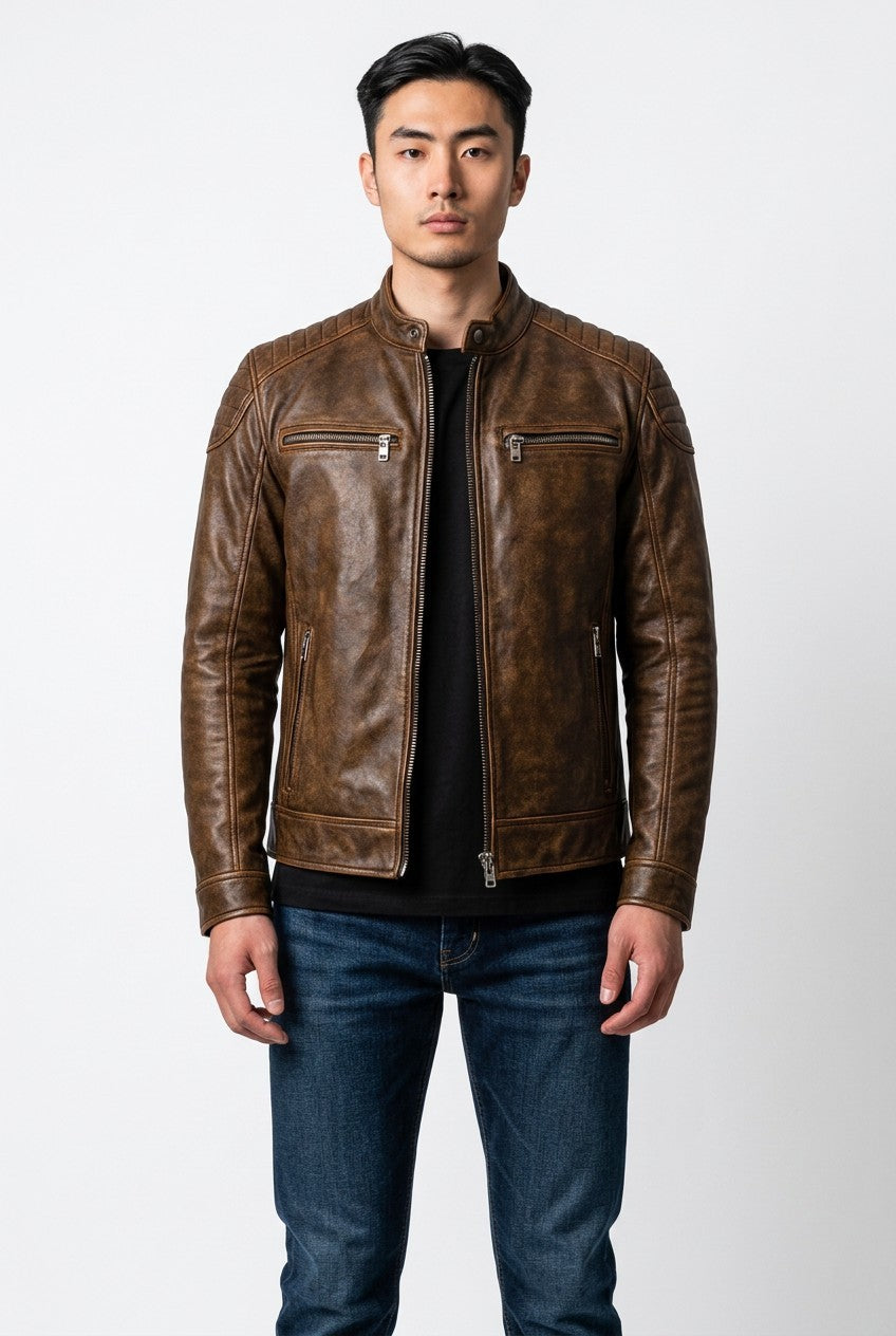 Scarlett Stitch men's distressed brown leather cafe racer jacket with quilted shoulders and zippered pockets.