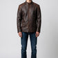 Scarlett Stitch men's distressed brown leather jacket with quilted shoulders and mandarin collar on a model