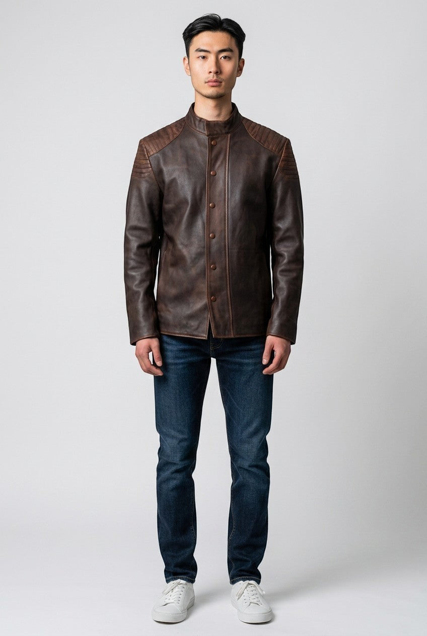 Scarlett Stitch men's distressed brown leather jacket with quilted shoulders and mandarin collar on a model