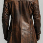 Back view of a Scarlett Stitch men's distressed brown leather trench coat with a structured fit and high collar.