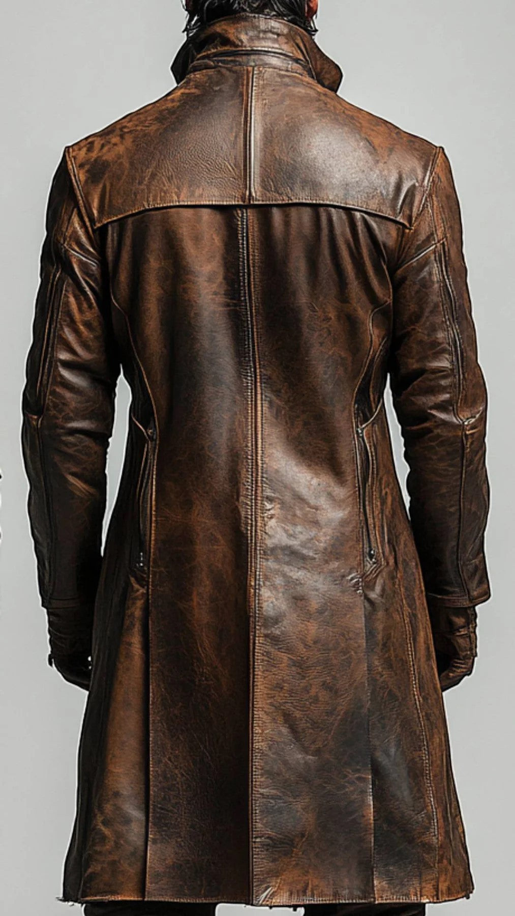 Back view of a Scarlett Stitch men's distressed brown leather trench coat with a structured fit and high collar.