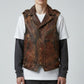Model wearing a brown Scarlett Stitch distressed leather biker vest with zip pockets and snap-button closures.