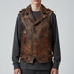 Model wearing a brown Scarlett Stitch distressed leather biker vest with snap buttons and zippered pockets.