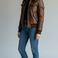 Scarlett Stitch women's distressed brown leather bomber jacket with sherpa collar and zip front.