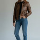 Scarlett Stitch women's distressed brown leather bomber jacket with sherpa collar, zip front, and utility pockets.