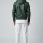 Scarlett Stitch forest green faux leather bomber jacket with attached hood, zip front, and ribbed cuffs and hem.
