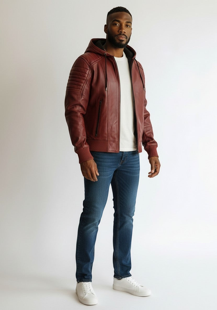 Scarlett Stitch Men's burgundy hooded leather bomber jacket with quilted shoulders and zippered pockets.
