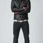 Scarlett Stitch Men's black faux leather moto jacket with stand-up collar, snap pockets, and epaulets.