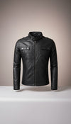 Scarlett Stitch Men's black faux leather moto jacket with stand-up collar, zip front, chest pockets, and epaulets.