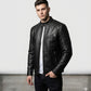 Scarlett Stitch men's black leather motorcycle jacket with quilted shoulder panels and mandarin collar on a model.